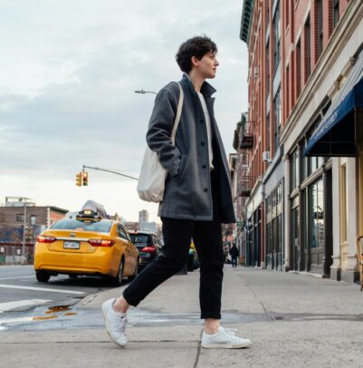 Woman walking confidently on a city sidewalk